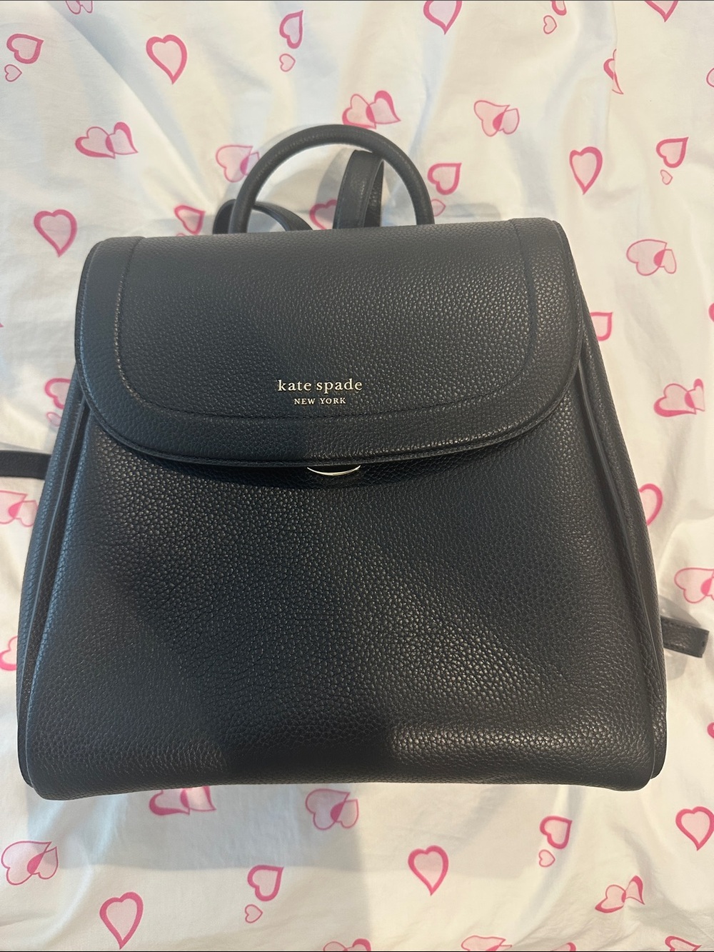kate spade black pebbled leather flap backpack